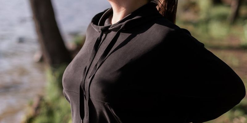 Side profile of a person practicing deep breathing exercises.